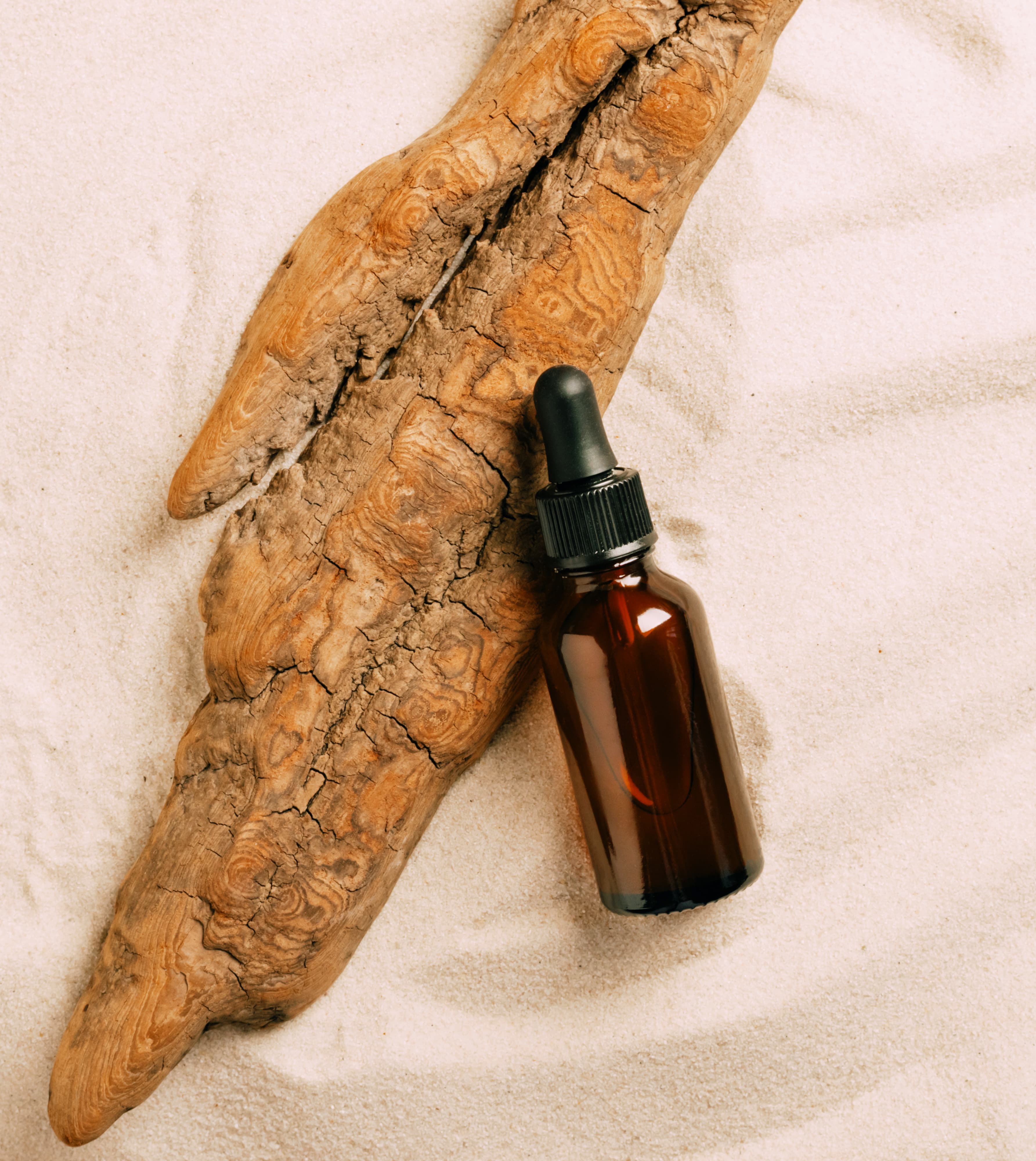 Essential oil bottles with natural greenery